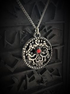 This Seal of Belial necklace is an handmade pewter sculpture with a gem of your choice (my favorite is the red abalone) This seal of Belial is one of the 72 Sigils of Goetia This Sigil of Goetia pendant is sold with a free 18'' stainless steel chain, if you would like to have a different length for the chain, you can write the desired length in the private note section when ordering :) This Seal of Belial is a pendant of 3cm diameter This Sigil of Belial is a pewter sculpture of my own creation, Silver Symbolic Medallion Necklace, Antique Silver Etched Pendant Necklace, Symbolic Ceremonial Etched Necklaces, Symbolic Etched Necklaces For Ceremonial Use, Symbolic Antique Finish Jewelry Collectible, Symbolic Etched Necklaces For Ceremonial Occasions, Symbolic Hand Forged Necklaces, Silver Hand Forged Medallion Jewelry, Symbolic Round Necklace With Intricate Design