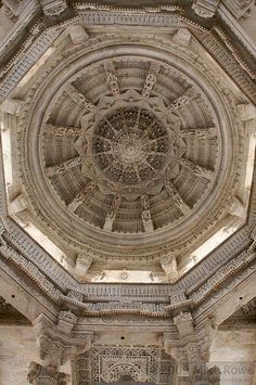 an intricate ceiling in the middle of a building