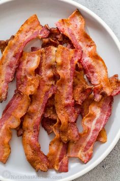 bacon strips on a white plate ready to be eaten