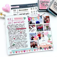 an open planner with pictures and hearts on it next to some other things that are in front of it