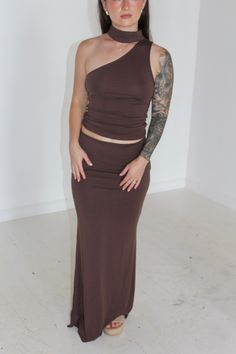 Our Teagan set is a two piece chocolate set made up of a one shoulder sleeveless mock neck top and a matching maxi skirt. This set is sure to bring out all your best assets and make you look your best with this tight hugging fabric. model is 5ft wearing a small Brown Fitted Maxi Skirt For Party, Sleeveless Mock Neck, Mock Neck Top, Look Your Best, Swim Accessories, Staple Pieces, Vintage Collection, Mock Neck, High Fashion