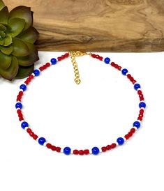 Handmade item * Materials * ----------------- 4mm Red Czech Glass Round Beads 6mm Royal Blue Smooth Glass Beads  8/0 White Glass Seed Beads (approximately 3mm) * Dimensions * -------------------- Total Length: 13" plus a 2" extender chain  (If you need a different size, please message me through Etsy so that I can create a new listing) * Details * ------------- This patriotic necklace was crafted with faceted red beads with small white seed beads and larger smooth blue glass beads.  The necklace Patriotic Round Beads Necklace As Gift, Patriotic Blue Round Bead Jewelry, Patriotic Round Beads Necklace Gift, Patriotic Blue Jewelry With Colorful Beads, Red Beaded Patriotic Necklaces, Blue Beaded Necklaces For 4th Of July, Patriotic Blue Beaded Necklaces, Patriotic Red Beaded Necklaces, Blue Beaded Necklace For 4th Of July