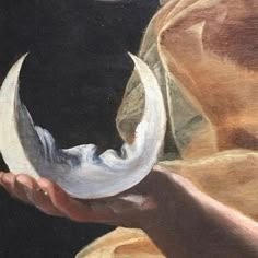 a painting of a hand holding a white object