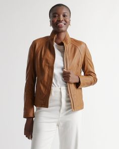 In a flattering fit and made from 100% top-grain leather, the Stand-Collar jacket is a timeless piece. With handy pockets and hidden front zip closure, this jacket is versatile and stylish for any type of event. Read more about what makes our leather special in our Leather 101 guide. Tan Leather Jacket, Stand Collar Jackets, Leather Stand, Real Leather Jacket, Classic Jacket, Quarter Zip Sweater, Collar Jacket, Woman Standing, Top Grain Leather