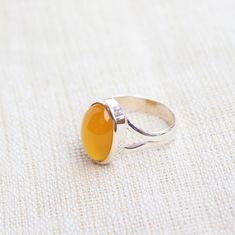 Gemstone - Mango Chalcedony Gemstone size - 10x14 mm Oval shape Metal - Sterling Silver Ring Size- All sizes available Each Ring made with Precision and love, these rings are perfect for everyday use and a perfect accessory to wear at work. Rings can be customized on request and gemstone can be switched to any other as per requirement. kindly visit my store to view the complete collection. Feel free to contact me for any queries regarding jewelry or for bulk order. The ring will be gift wrapped Yellow Oval Cabochon Gemstone Ring, Amber Rings With Large Stone For Anniversary, Adjustable Oval Amber Ring, Yellow Oval Cabochon Ring For Gift, Chalcedony Crystal, Rings Anniversary, Stack Rings, Plus Size Rings, Dainty Rings