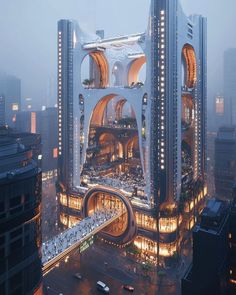 an aerial view of a large building in the middle of a city at night time