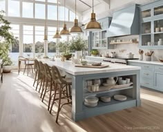 a kitchen filled with lots of counter top space next to a dining room table and chairs