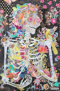 a piece of art that looks like a skeleton with flowers and birds on its back