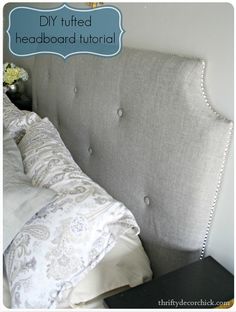 an upholstered headboard with buttons and beading on the top is shown