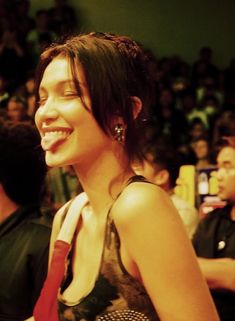 a woman smiling in front of an audience