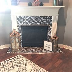 a fireplace with a sign that says choose happy on it and two lanterns next to it