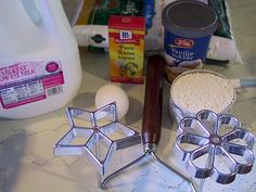 the ingredients to make an apple pie are shown on the counter, including flour, sugar and eggs