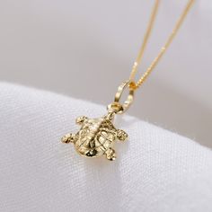 Our stunning new Turtle Pendant Necklace is handcrafted in solid 9ct gold. This makes the perfect present for somebody who is environmentally conscious and a lover of marine life. Turtles are so special and These cold-blooded creatures have an incredibly long life span. The oldest ever recorded, named Tu”i Malila, of Tonga Island, passed away at the grand old age of 188! Turtles belong to one of the oldest reptile groups in the world – beating snakes, crocodiles and alligators! They are such spi Spiritual Animals, Tonga Island, Posh Totty, Cold Blooded, Solid Gold Necklace, Turtle Pendant, Neck Jewellery, Old Age, Environmentally Conscious