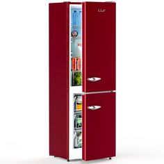 a red refrigerator freezer sitting inside of a kitchen