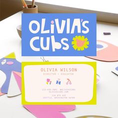 the business card for ollivia's cups is displayed next to some crafting supplies