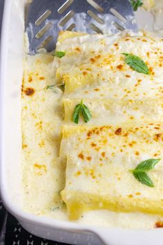 a casserole dish with cheese and herbs