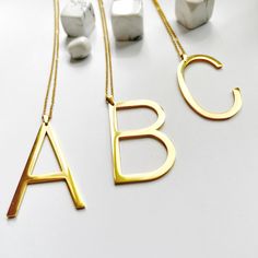 "Very large initial letter necklace, made from high quality stainless steel, this statement piece of jewellery is not one to go un-noticed.  The large letter pendant measures a sizeable 2\" (5cm) in height and is running freely on a long 28\" (71cm) chain necklace and all components are from high quality, 18K Gold plated stainless steel. Gift wrapping is offered as well, at £3 per item, by following this link: https://www.etsy.com/uk/listing/1527765076. Please note that the gift wrapping is per individual item (eg: should you like to purchase 3 items, from any listings in my shop, and would like them all gift wrapped, then follow this link to purchase 3 gift wrapping)." Letter Necklace Gold, Initial Letter Necklace, Gold Initial Necklace, Gold Letter Necklace, Initial Necklace Gold, Gold Initial, Lovely Necklace, Letter Pendants, Initial Letter