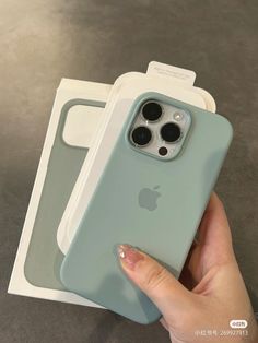 a person holding an iphone case in their hand