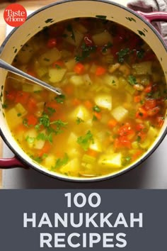 a pot filled with soup on top of a wooden table