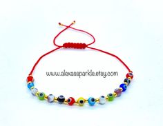 This beautifully handmade bracelet is made of round medium sized (4mm) glass eye beads that are multi-colors. They are made with nylon thread and have a woven sliding knot that allows it to fit most wrists. These are a great accessory for any occasion and everyday use. In many cultures it is is believed that when a person wears or carries an evil eye with them, it guards against misfortune happening in one's life. The evil eye is believed to bring good luck and protect from any ill-will that cou Multicolor Evil Eye Friendship Bracelets With Round Beads, Adjustable Evil Eye Bracelet, Multicolor Adjustable Evil Eye Bracelet As Gift, Adjustable Spiritual Evil Eye Bracelet With Tiny Beads, Adjustable Multicolor Evil Eye Bracelet As Gift, Adjustable Evil Eye Bracelet With 8mm Beads, Adjustable Spiritual Evil Eye Bracelet With Colorful Beads, Spiritual Adjustable Evil Eye Bracelet With Colorful Beads, Adjustable Multicolor Evil Eye Bracelet With Tiny Beads