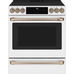 a white stove with gold trim and two burners on the front, and an oven door