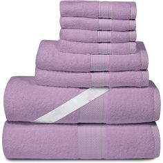 a stack of purple towels with a white stripe