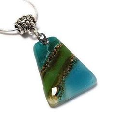 a green and blue glass pendant on a silver chain