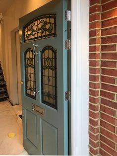 a blue door with stained glass on it