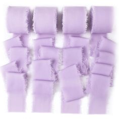 several pieces of purple fabric with torn edges