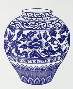 a blue and white vase sitting on top of a table