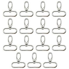 10 pairs of metal d - rings on white background