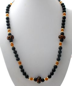 Vintage Beaded Jewelry - This is a stylish black onyx bead necklace with amber art glass and gold plated spacers. It is 28" long, gemstones are .38" (10mm) and the art glass beads are slightly over .75 (29mm), weighs 111 grams. Onyx Bead, Beaded Necklaces, Black Beads, Bead Necklace, Black Onyx, Art Glass, Onyx, Beaded Jewelry, Glass Art