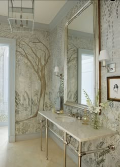 the bathroom is decorated with wallpaper and mirrors