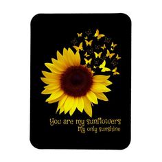 a sunflower and butterflies with the words you are my sunshine in gold on a black background