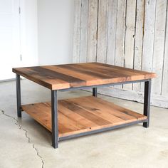 a coffee table made out of wood and metal