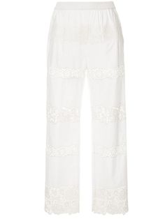 Dolce & Gabbana are the height of romanticism, femininity and Italian luxury. Along with bright colours and signature floral blooms, the designers behind the iconic brand are expert in fashioning timeless essentials for the woman of any age. Introduce an air of sophisticated luxury to your SS19 looks with these white cotton and silk blend embroidered trousers from Dolce & Gabbana. Featuring a high rise, a pull-on style, an elasticated waistband, side pockets, embroidered details and a straight l