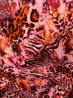 an animal print fabric is shown with different colors and patterns on the fabric, including red, pink, orange, black, and white