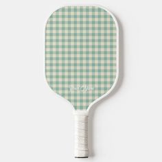 a green and white checkered paddle with the words, you're one on it