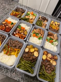 several trays filled with different types of food