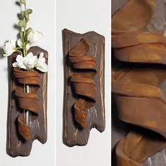 there are two pieces of wood with flowers on them and one piece of wall hanging