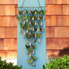 Bring light style and sound to your garden easily using these Ancient Graffiti Copper and Verdi Butterfly Shimmering Bells. This unique, all metal adornment combines verdigris toned butterfly shapes with copper colored bells, enhancing your home or garden in an exciting new way. A 13.75" long, slightly curving metal rod supports ten chains, each sporting alternating bell and butterfly shapes. These extensions increase in length toward the center of the base, forming an inverted triangle for a ge Butterfly Door, Butterfly Wind Chime, Outdoor Metal Art, Unique Wind Chime, Butterfly Mobile, Door Bells, Unique Doors, Butterfly Wall, Butterfly Garden