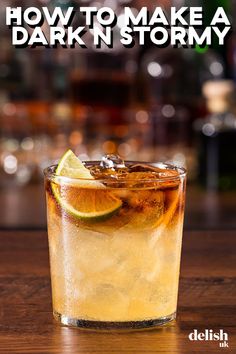 a close up of a drink on a table with the words how to make a dark n stormy