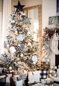 a decorated christmas tree with black and white ornaments