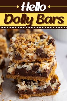 chocolate and coconut bars stacked on top of each other with the words hello dolly bars above them