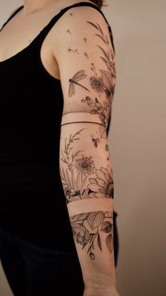 a woman with a tattoo on her arm