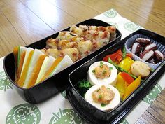 two plastic containers filled with food on top of a table