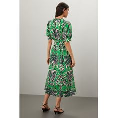 Green floral (100% Cotton). Casual dress. Short sleeves. V-neck. Tie closure. 53" from shoulder to hemline. Imported. Green Floral Print Maxi Length V-neck Dress, Green Floral Print Maxi V-neck Dress, V-neck Printed Floral Dress For Garden Party, Green Floral Print Midi Dress With Surplice Neckline, Green Floral Print Midi V-neck Dress, Green Printed V-neck Dress, Floral Print Midi V-neck Dress For Day Out, Floral Midi V-neck Dress For Day Out, Floral Print Dress With Surplice Neckline For Day Out