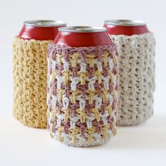 three crocheted can holders with red and white cans