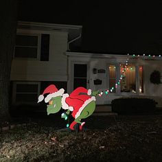 a christmas yard decoration in front of a house