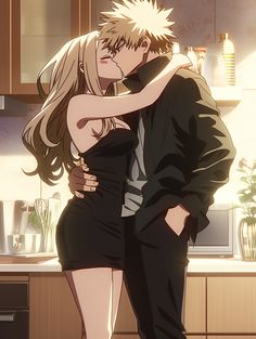 a man and woman are hugging in the kitchen, one is wearing a black dress